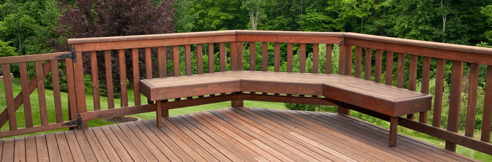 Wooden decking with fencing and corner bench seating